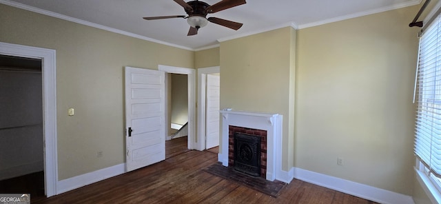 unfurnished living room featuring dark wood-type flooring, ceiling fan, a fireplace, and ornamental molding