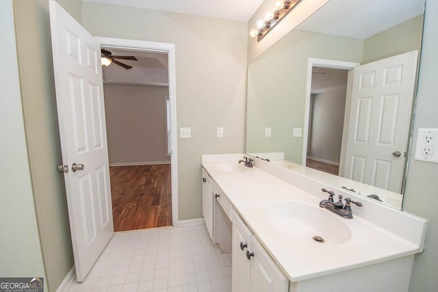 bathroom with ceiling fan and vanity