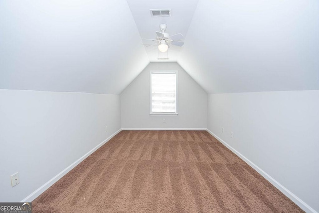 bonus room with ceiling fan, carpet, and lofted ceiling