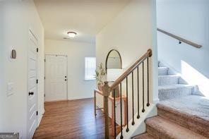 staircase with wood-type flooring