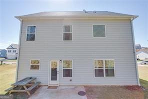 rear view of property featuring a patio