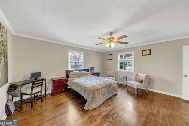 bedroom with a textured ceiling, baseboards, wood finished floors, and ornamental molding