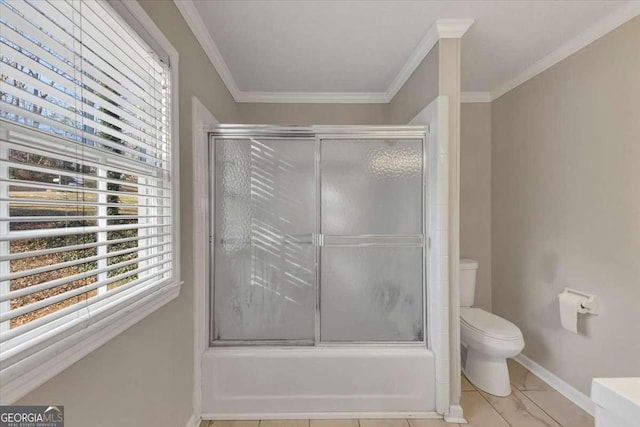 bathroom with enclosed tub / shower combo, baseboards, toilet, and crown molding