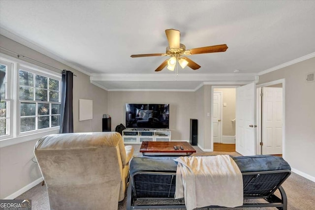 living area featuring visible vents, ornamental molding, a ceiling fan, light carpet, and baseboards