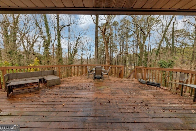 wooden terrace featuring an outdoor hangout area and outdoor dining area