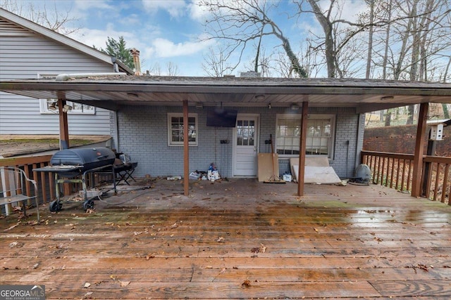 wooden deck with grilling area