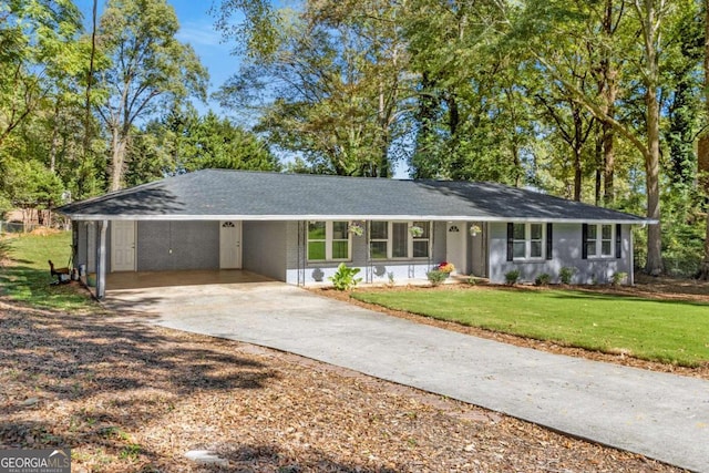 ranch-style home with a front lawn and a carport