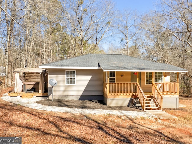 ranch-style home featuring covered porch