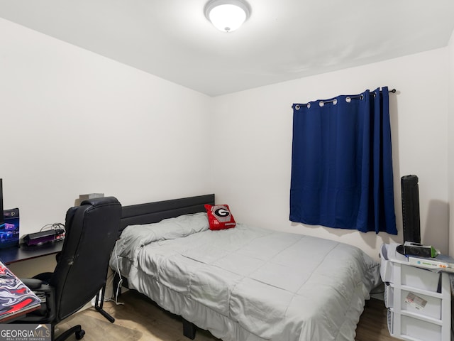 bedroom featuring hardwood / wood-style floors