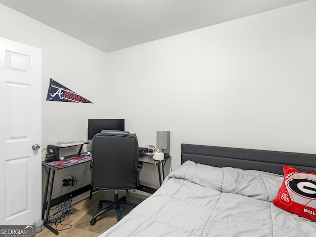 bedroom with hardwood / wood-style flooring