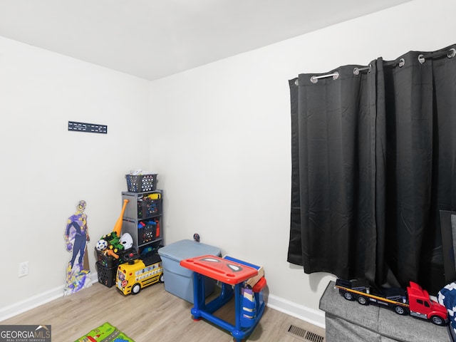 recreation room featuring hardwood / wood-style flooring