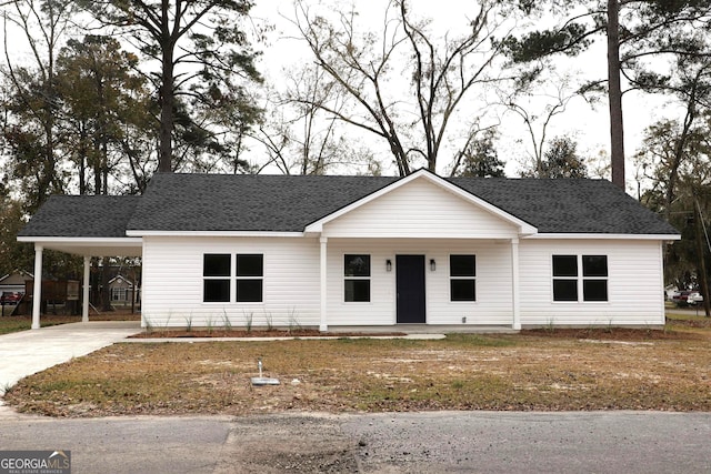 view of front of property featuring a carport