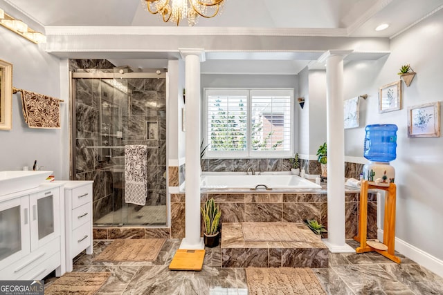 bathroom featuring ornate columns, marble finish floor, a garden tub, and a stall shower