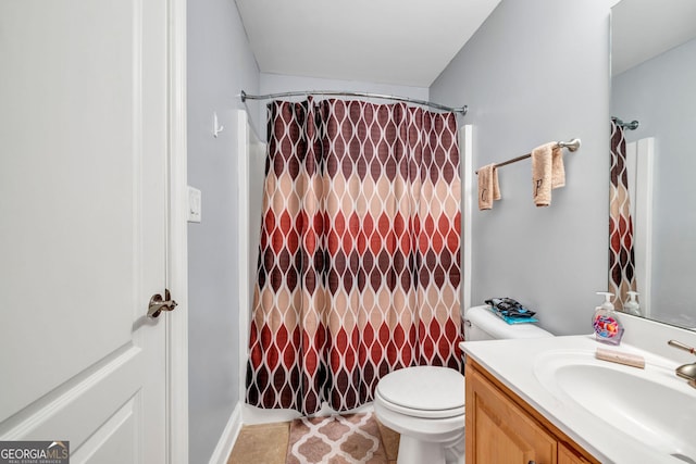 bathroom with a shower with curtain, vanity, and toilet