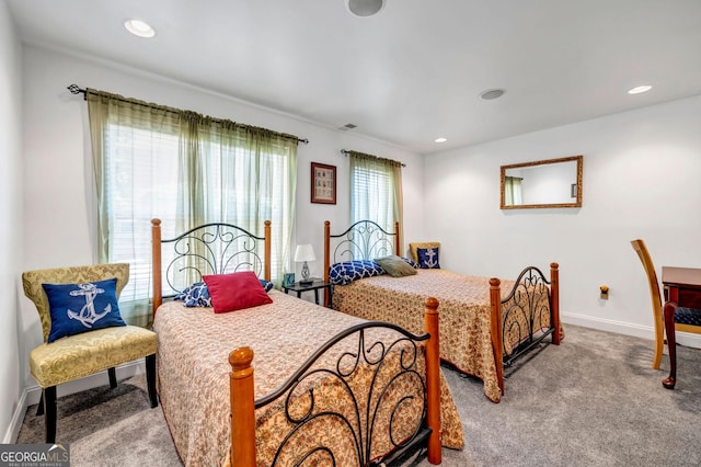 carpeted bedroom with recessed lighting, visible vents, and baseboards