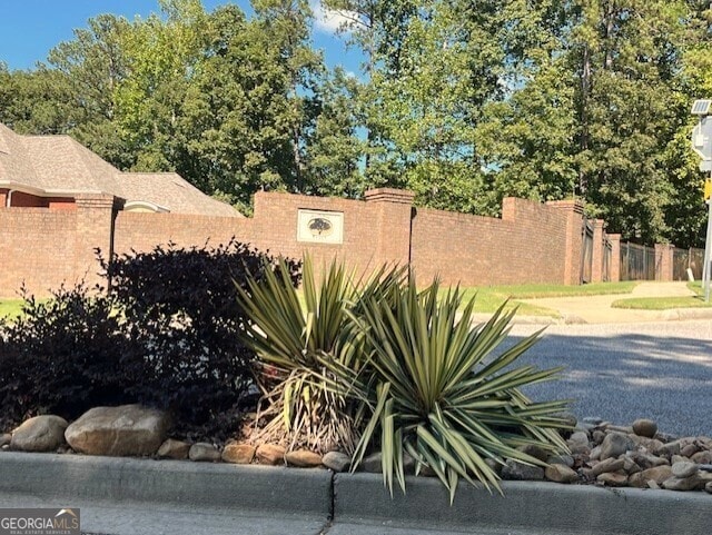 community sign with fence