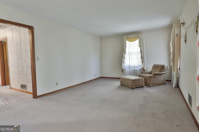 unfurnished room with light carpet