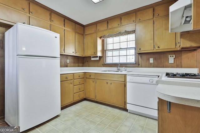 kitchen with extractor fan, sink, and white appliances