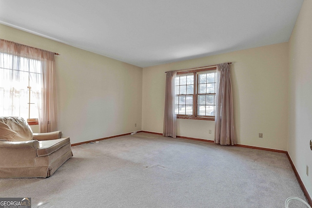 unfurnished room with light carpet