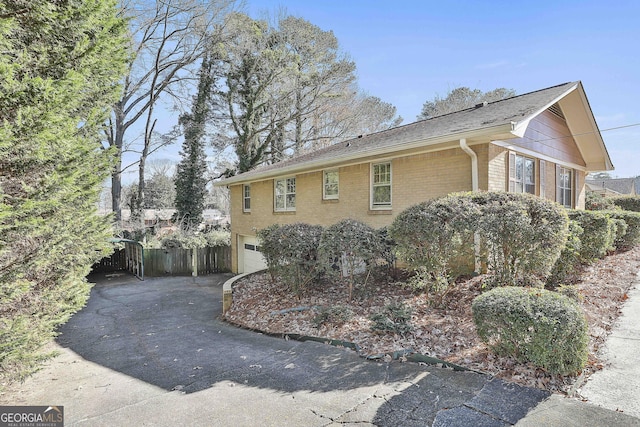 view of side of property with a garage