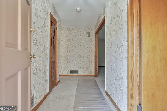 hallway with light carpet