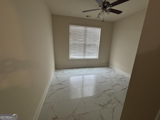 empty room featuring ceiling fan