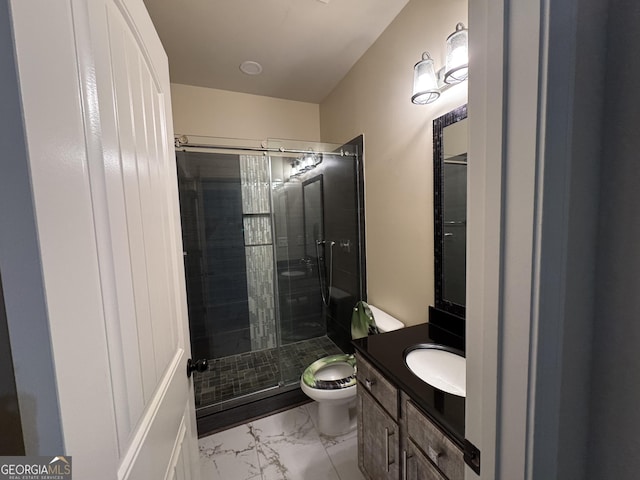 bathroom with toilet, a shower with door, and vanity