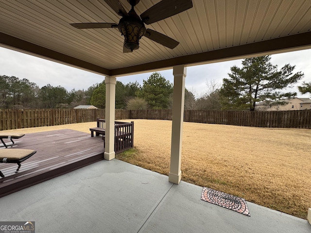 view of patio with ceiling fan and a wooden deck