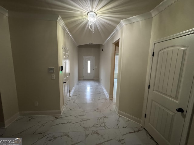 hallway featuring a chandelier and ornamental molding