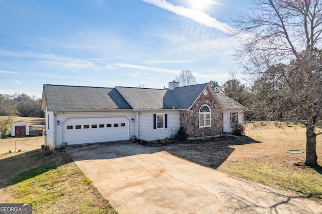 view of front facade with a front yard and a garage