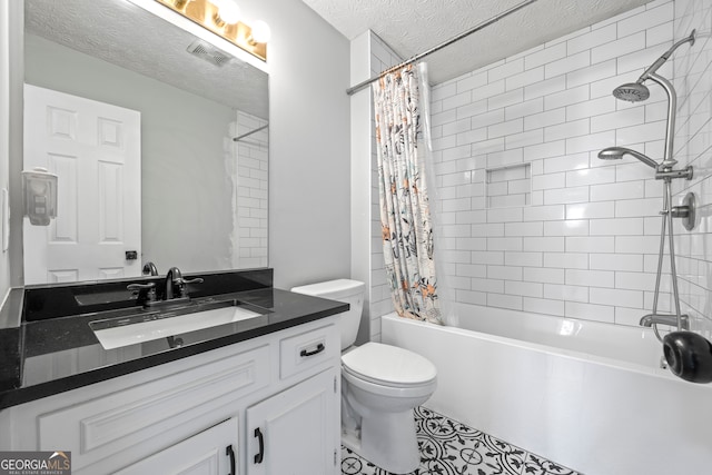 full bathroom featuring toilet, vanity, shower / tub combo with curtain, and a textured ceiling