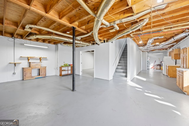 basement featuring white fridge