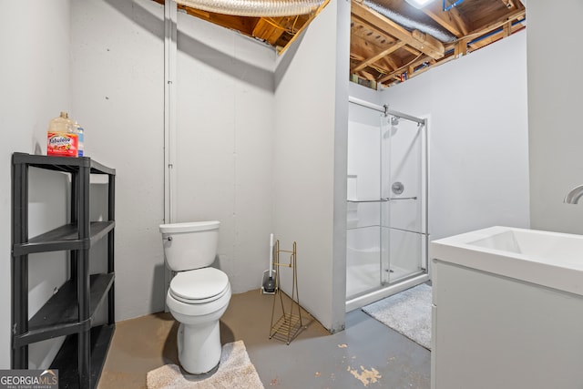 bathroom featuring toilet, concrete flooring, walk in shower, and sink