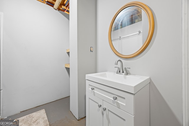 bathroom featuring vanity and concrete flooring