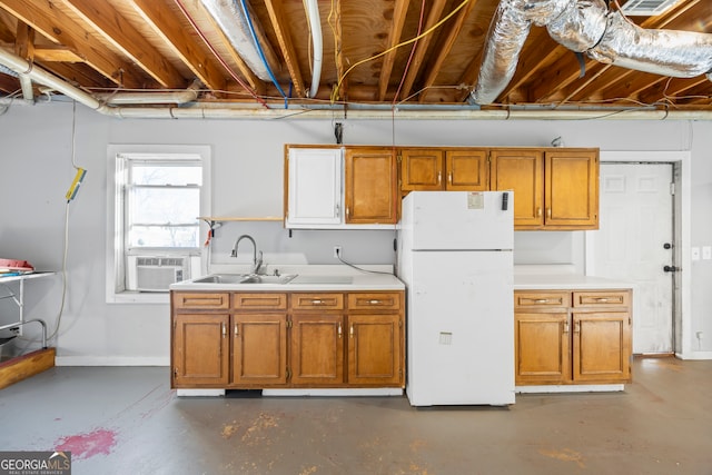 kitchen with sink, cooling unit, and white refrigerator