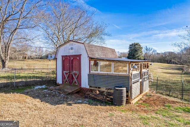 view of outbuilding with a rural view