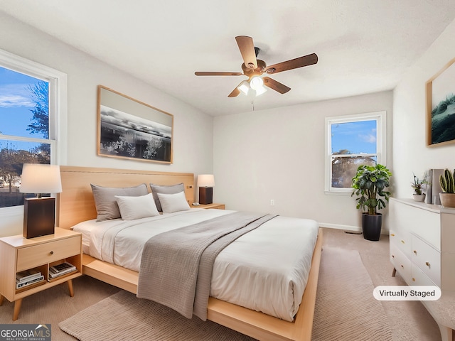 carpeted bedroom featuring ceiling fan