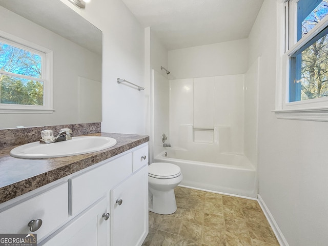 full bathroom with toilet, vanity, and shower / washtub combination