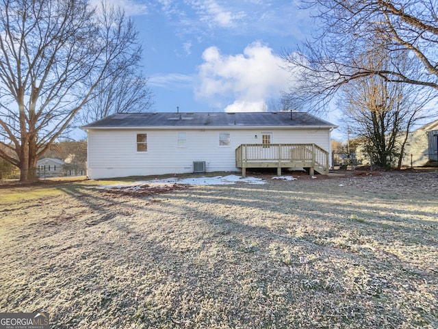 back of house featuring a deck and cooling unit