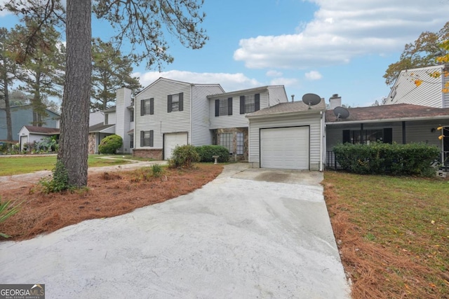 view of front of home featuring a garage and a front yard