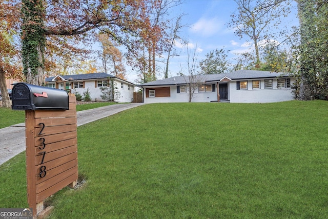 single story home featuring a front yard