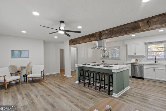 kitchen featuring island exhaust hood, dishwasher, beam ceiling, white cabinets, and a center island