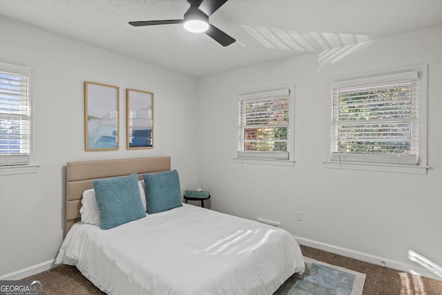 bedroom featuring ceiling fan and carpet floors