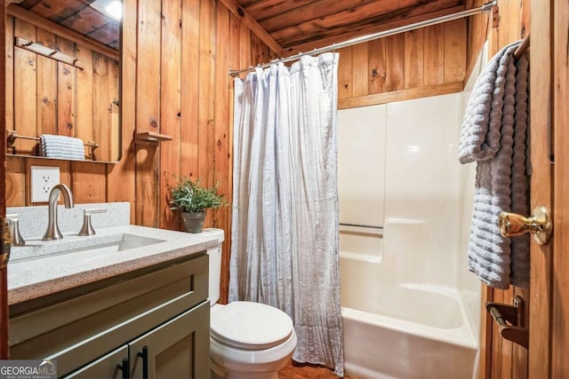 full bathroom with toilet, wood walls, wooden ceiling, shower / tub combo, and vanity