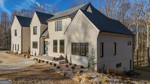 exterior space featuring central AC and a patio area