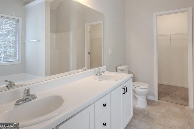 bathroom featuring toilet and vanity