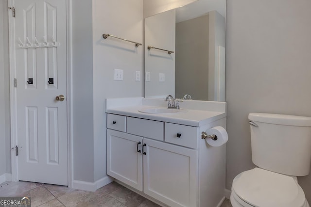 bathroom featuring toilet and vanity