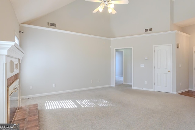 unfurnished living room featuring a brick fireplace, ceiling fan, light colored carpet, and high vaulted ceiling