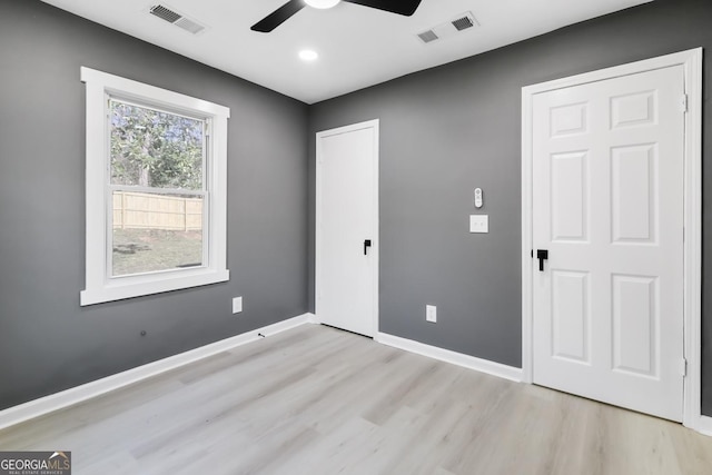 interior space with light wood-type flooring and ceiling fan