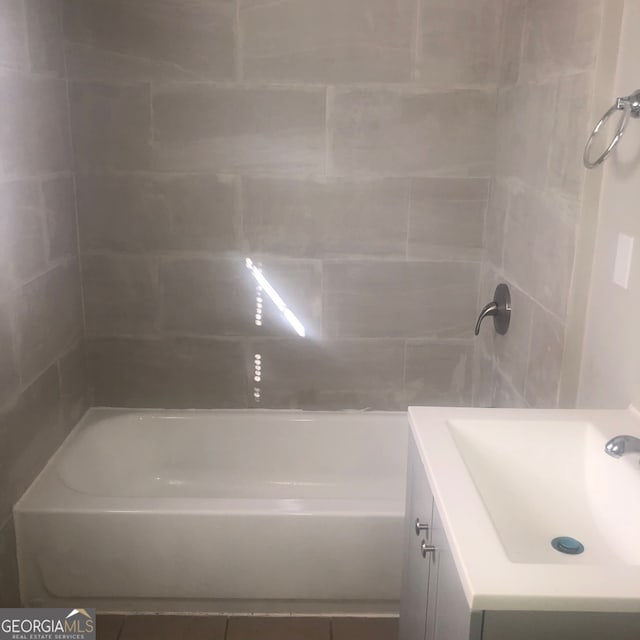 bathroom with tile patterned flooring and vanity